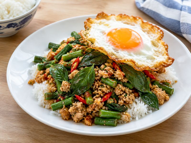 Illustration of Thai holy basil chicken stir-fry (pad kra pao)