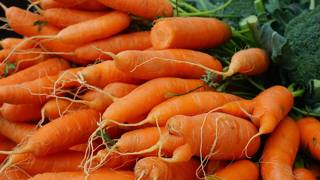 A bunch of carrots at a market