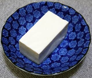 A block of silken tofu on a plate